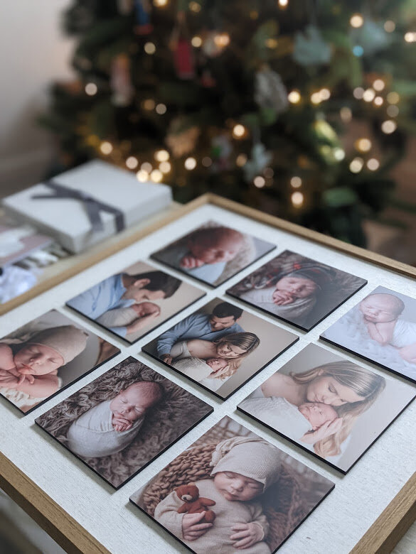 Storyboard wall art with 9 photographs oh newborn and family within the frame