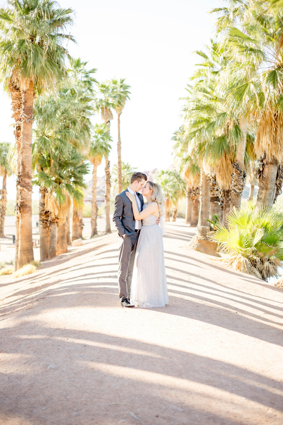 Capture the whimsy of your love with an engagement session at Papago Park in Scottsdale. This gallery features striking red rock formations, serene desert scenery, and playful moments that reflect the joy and excitement of your engagement