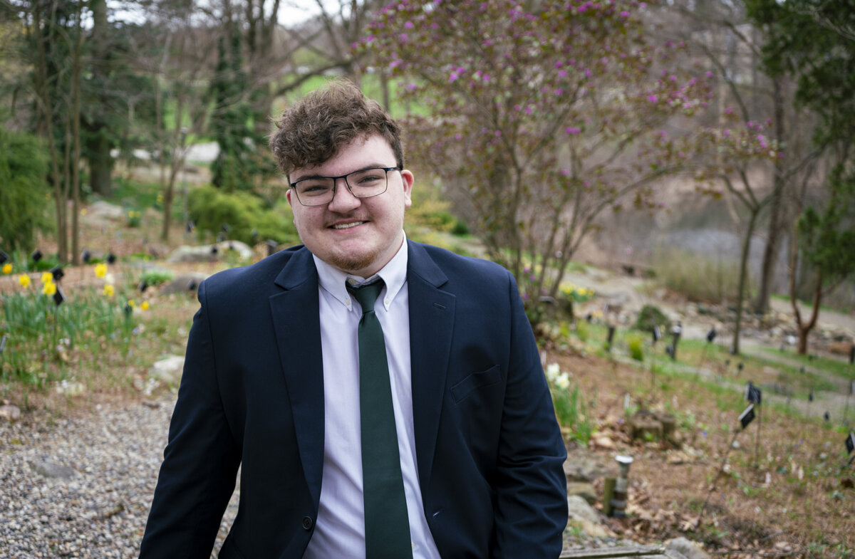 Senior portrait of a young man in a suit
