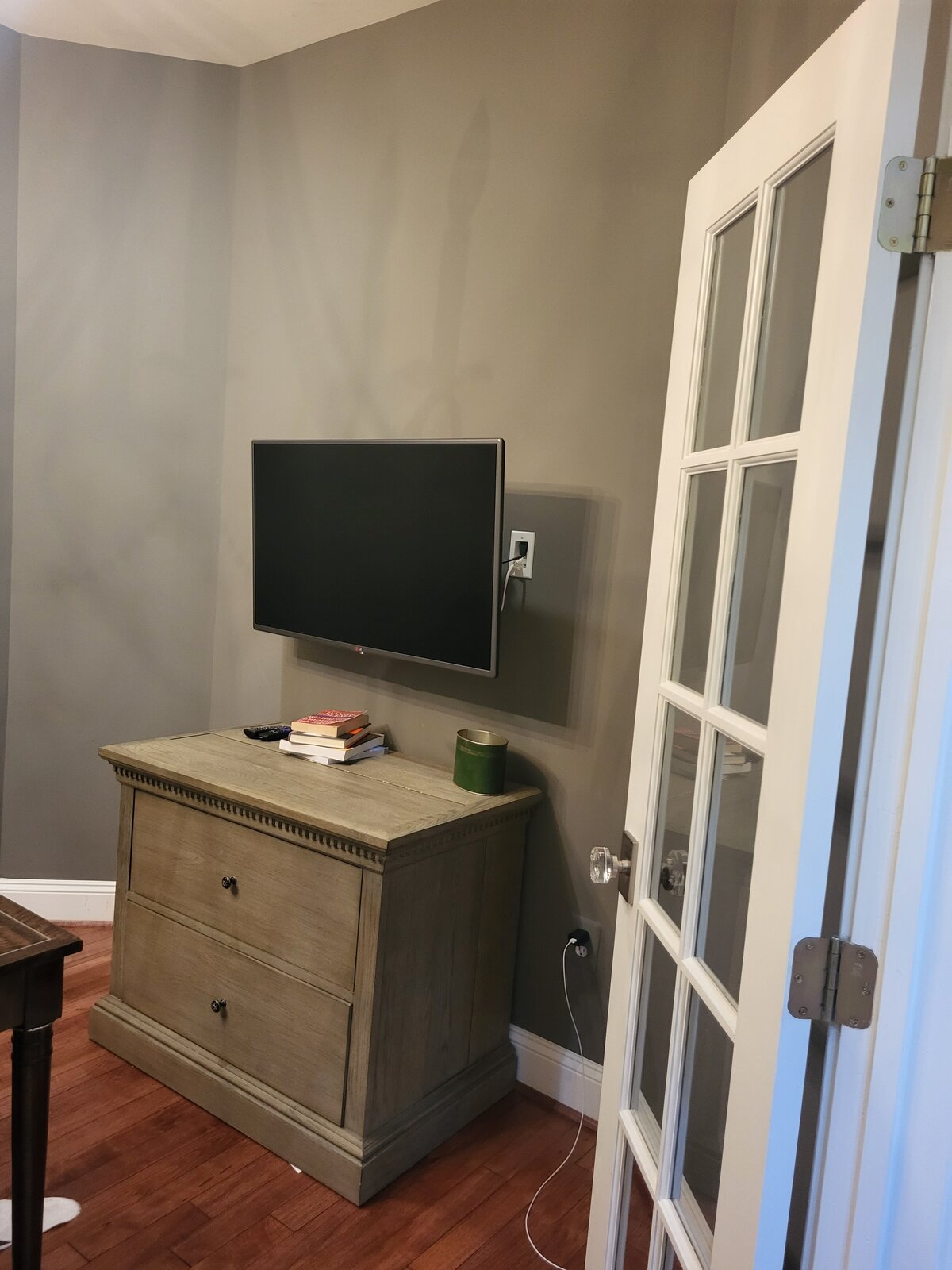 office with tv, furniture file cabinet and large oversized desk