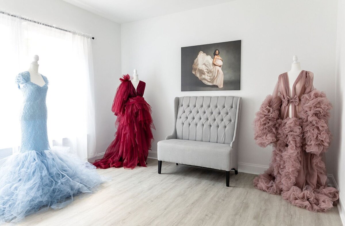 Lisa Yvette's photography studio showing elegant maternity gowns