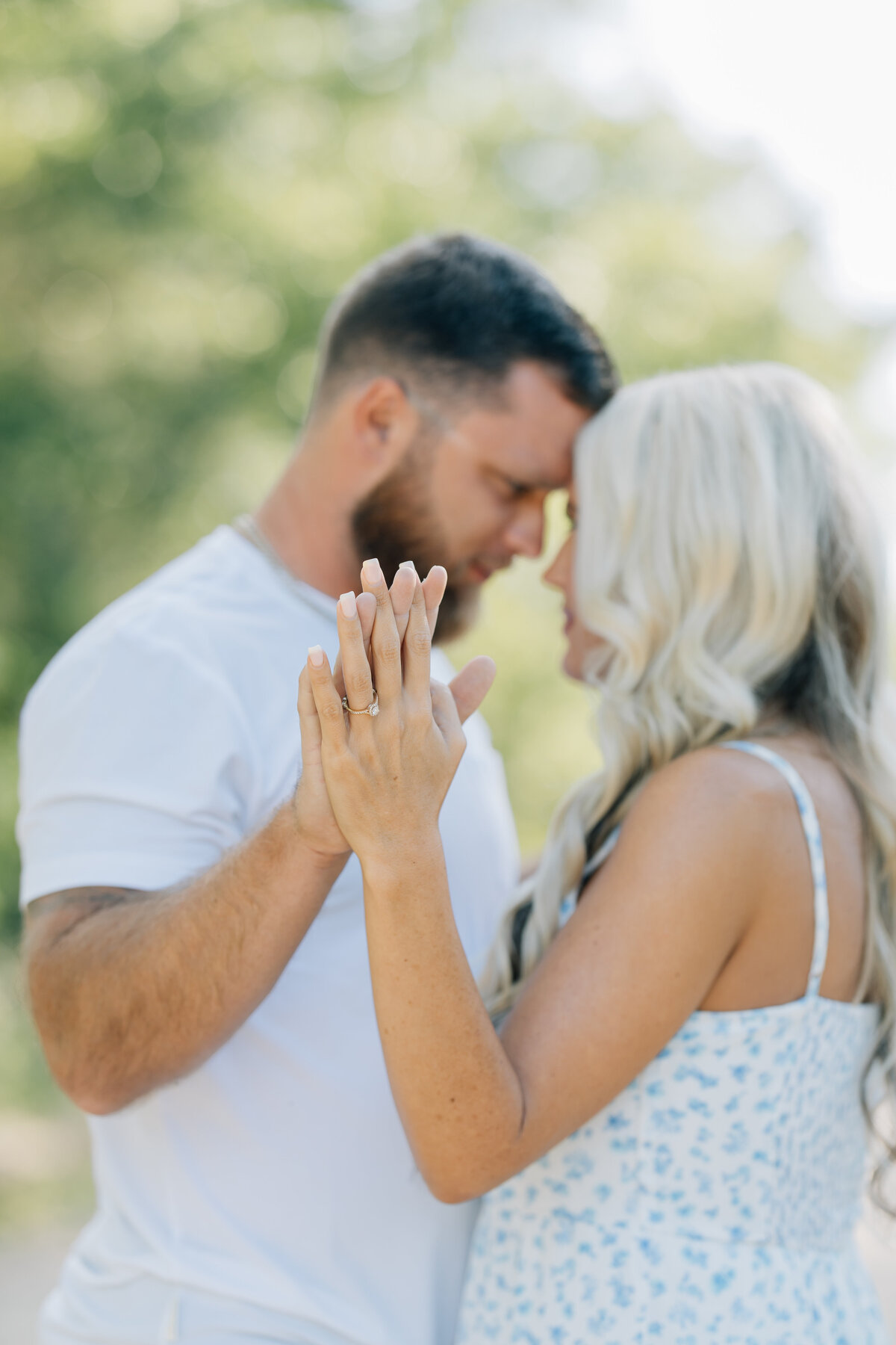 couple touching palms while gazing into each other's eyes