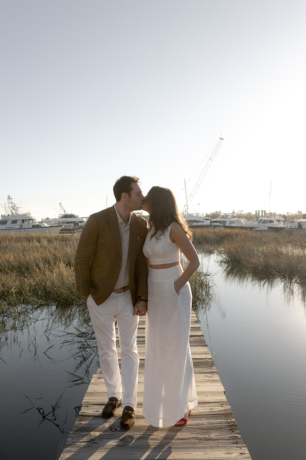 Couple shares a kiss at Historic Rice Mill engagement photo