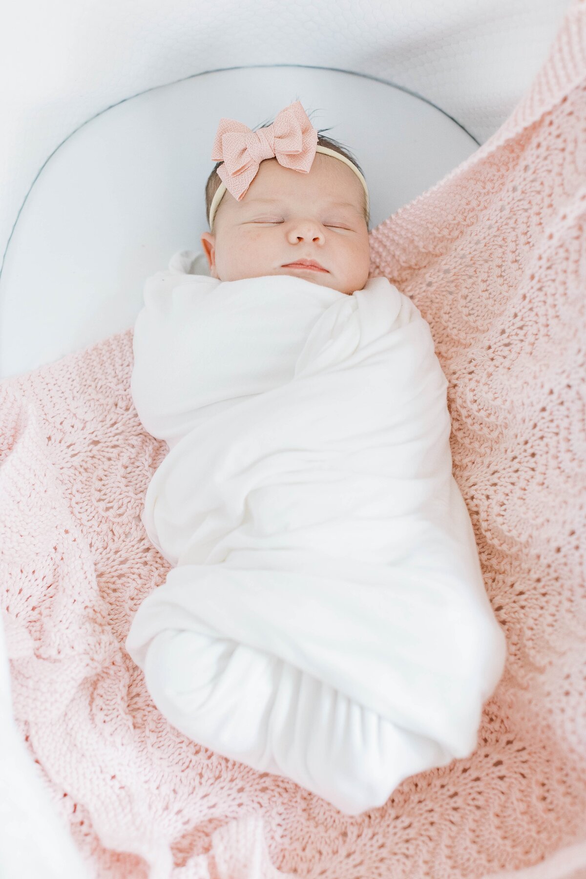 newborn baby in a bassinet