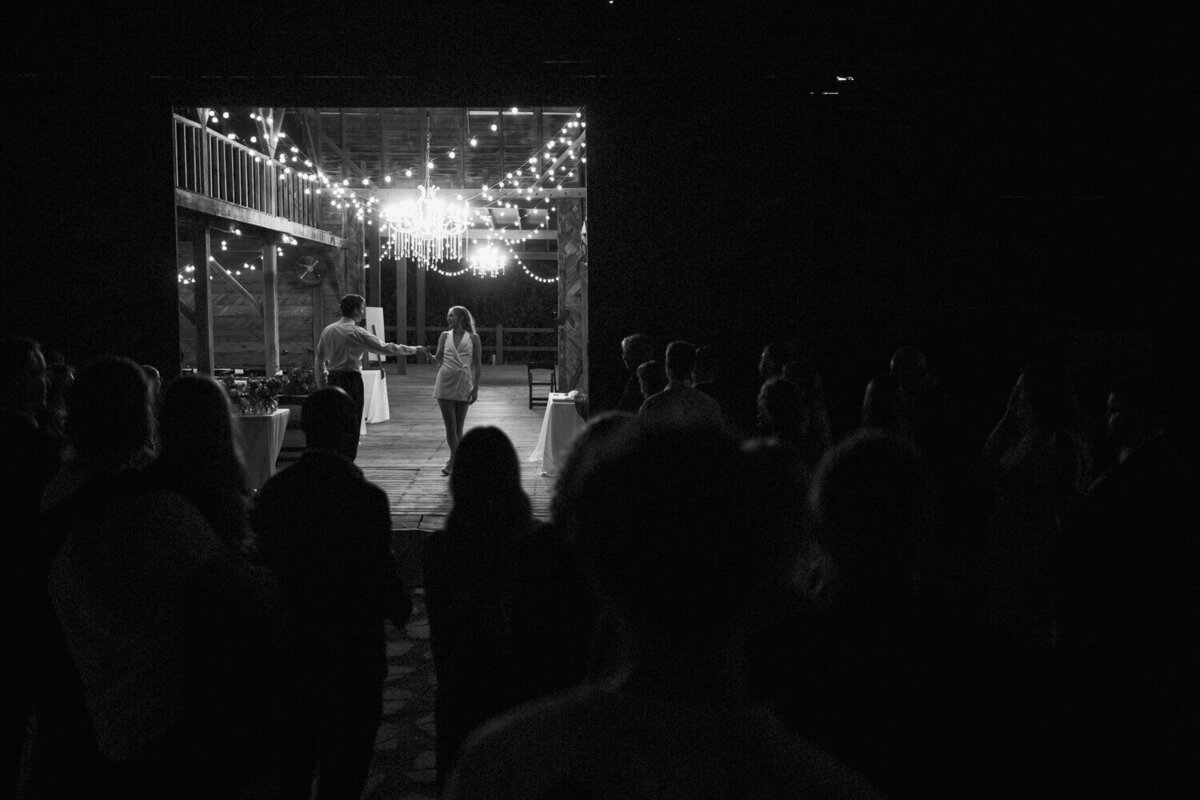 couple-having-last-dance-with-guests-watching