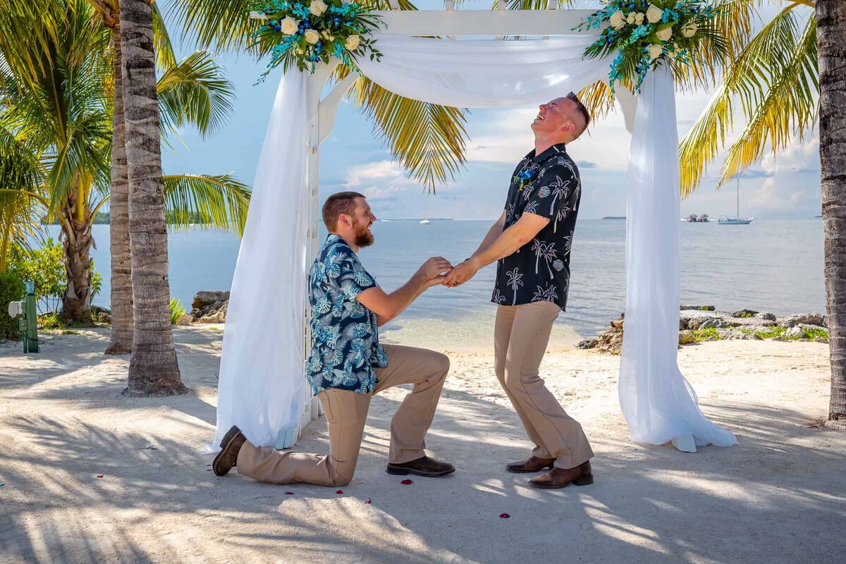 Groom and his best man joking around right before the wedding ceremony at Key Largo Wedding  venue captured by South Florida Wedding Photographer