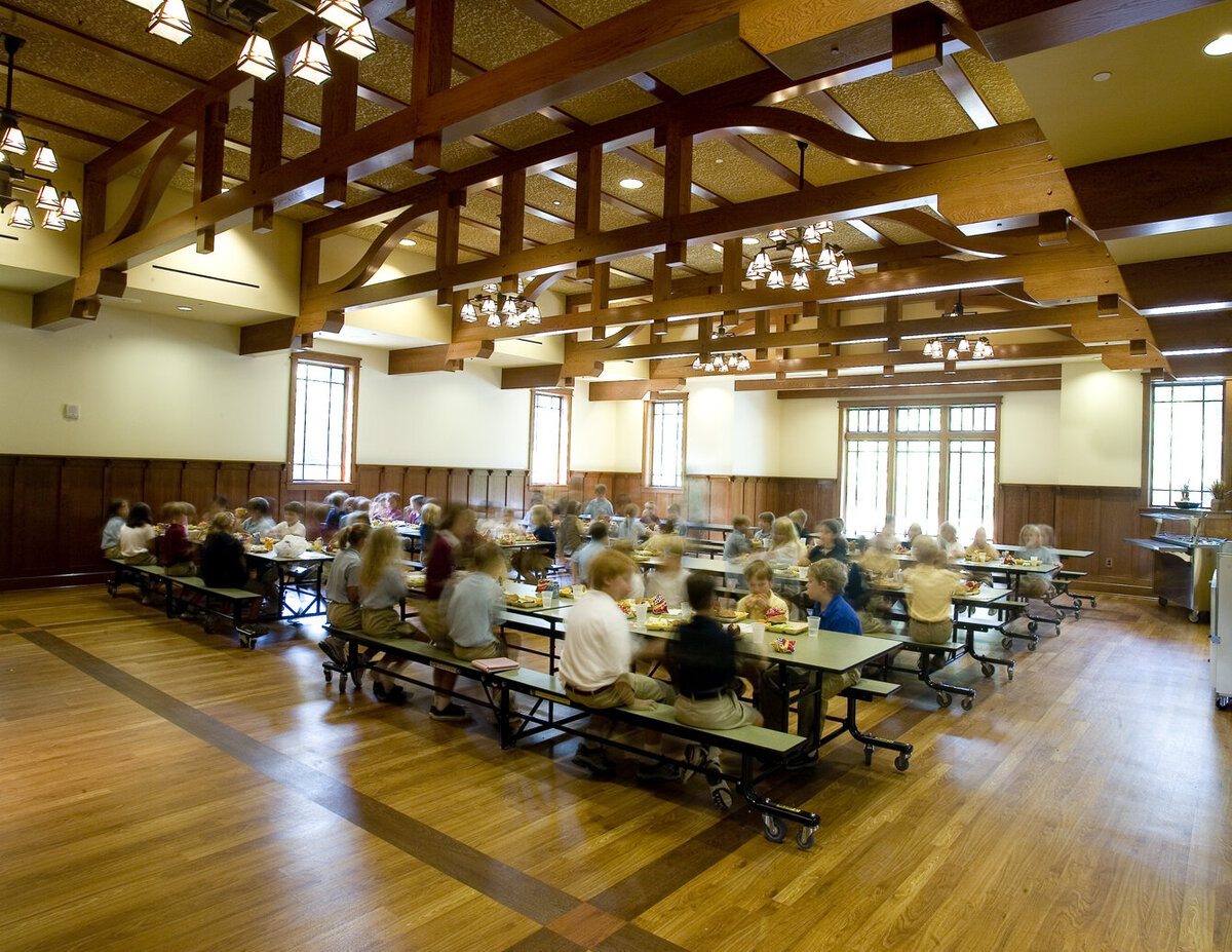 interior of the student commons with timber trusses at Schenck School