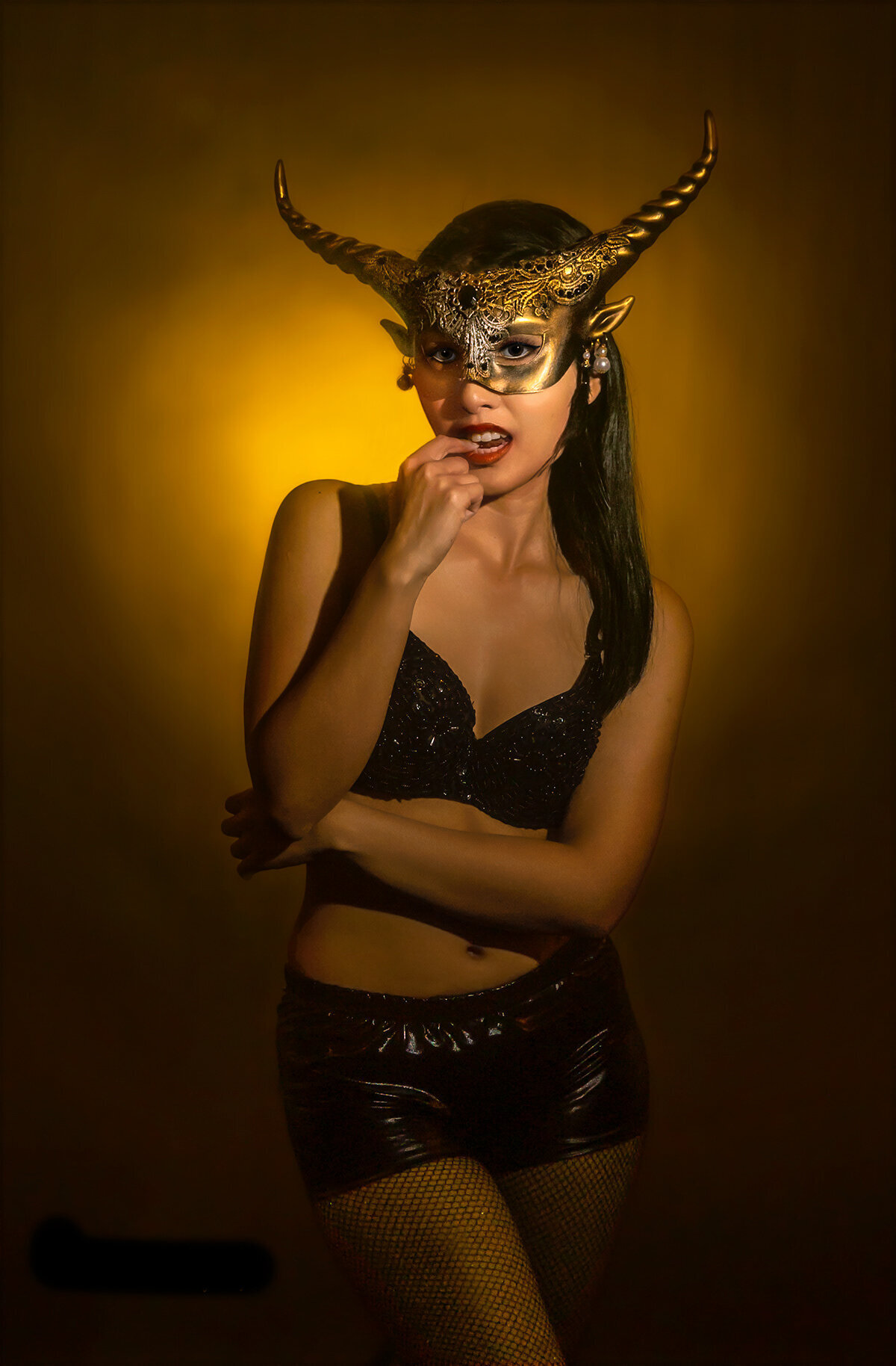 THITINAN STEWART WITH GOAT MASK ON GOLD BACKGROUND