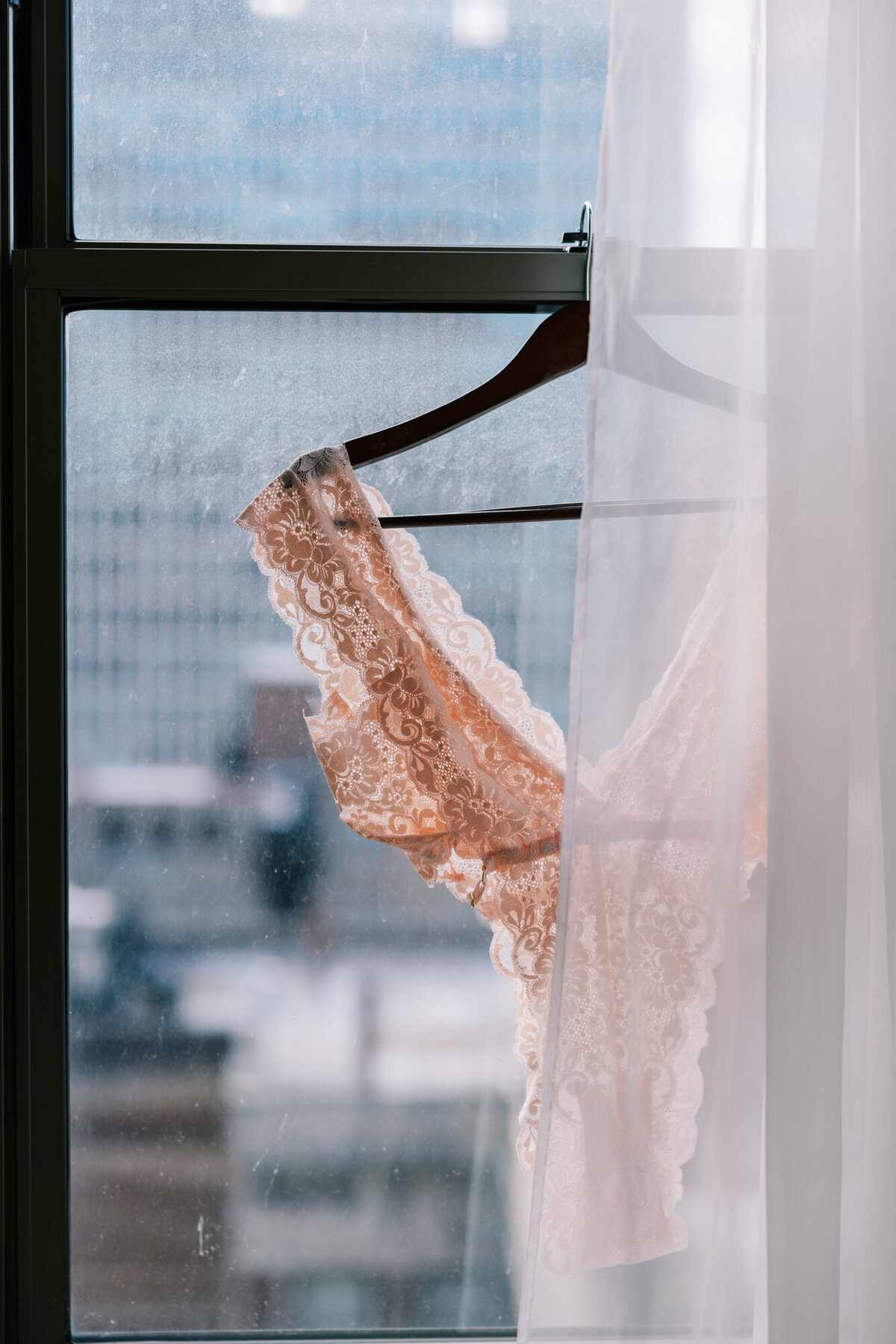 Delicate lace lingerie styled for a modern bridal boudoir session