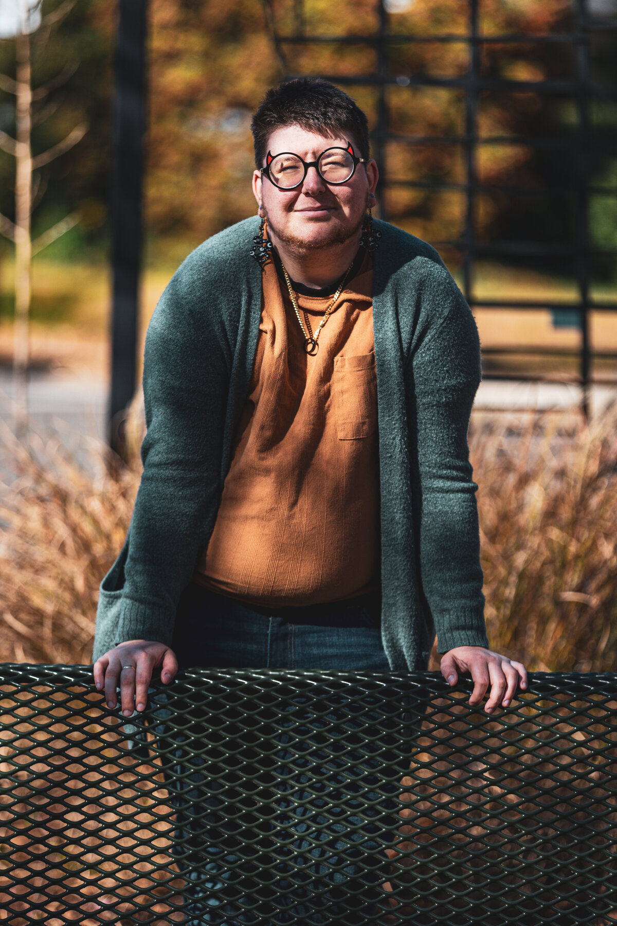 A person leaning on a bench.