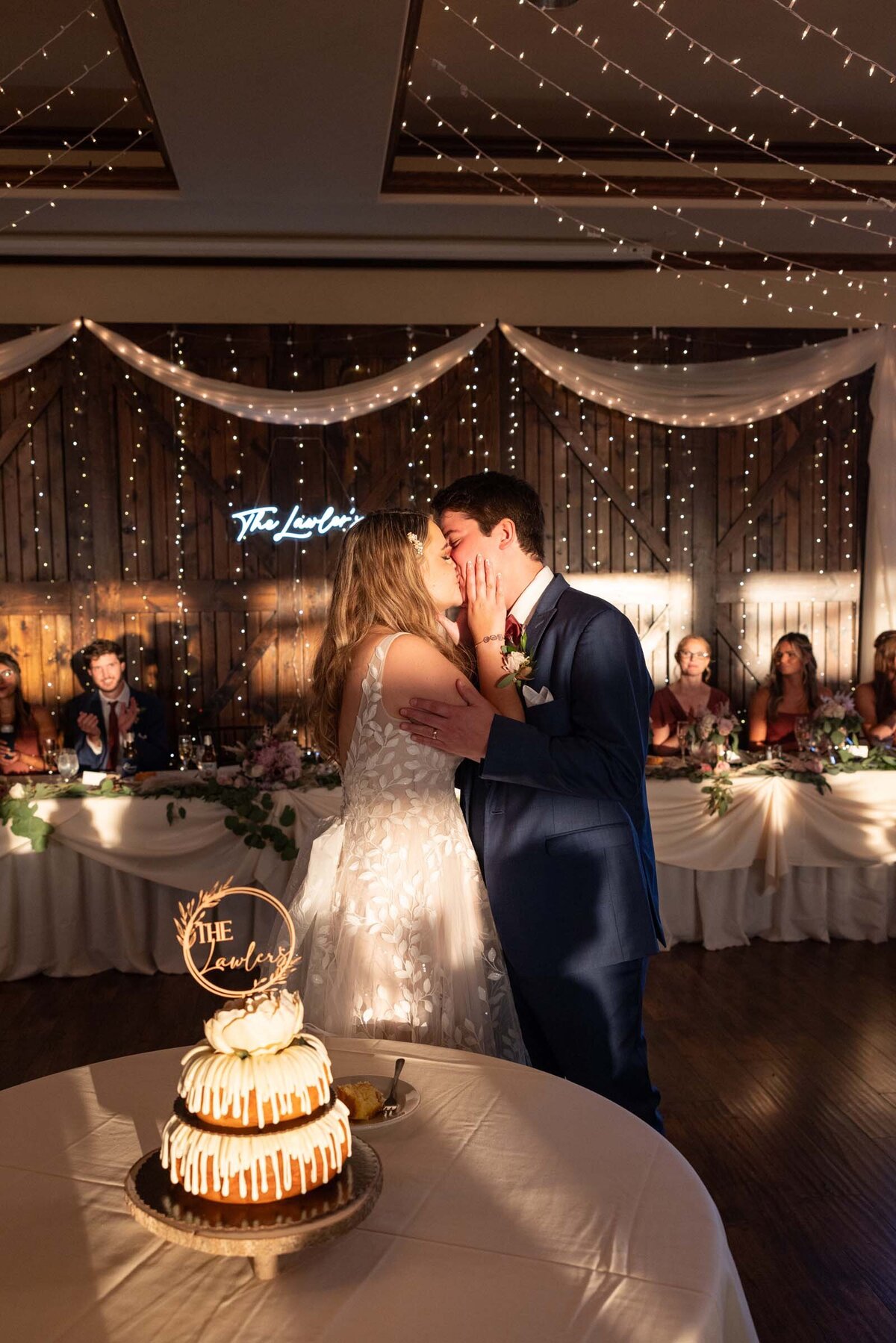 newlyweds-kissing-after-cutting-cake