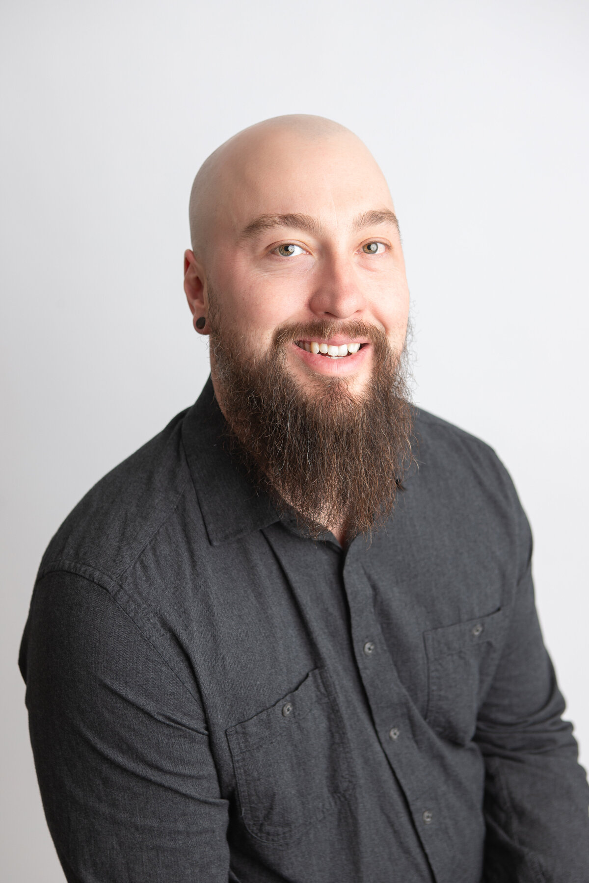 Studio headshot with plain white background
