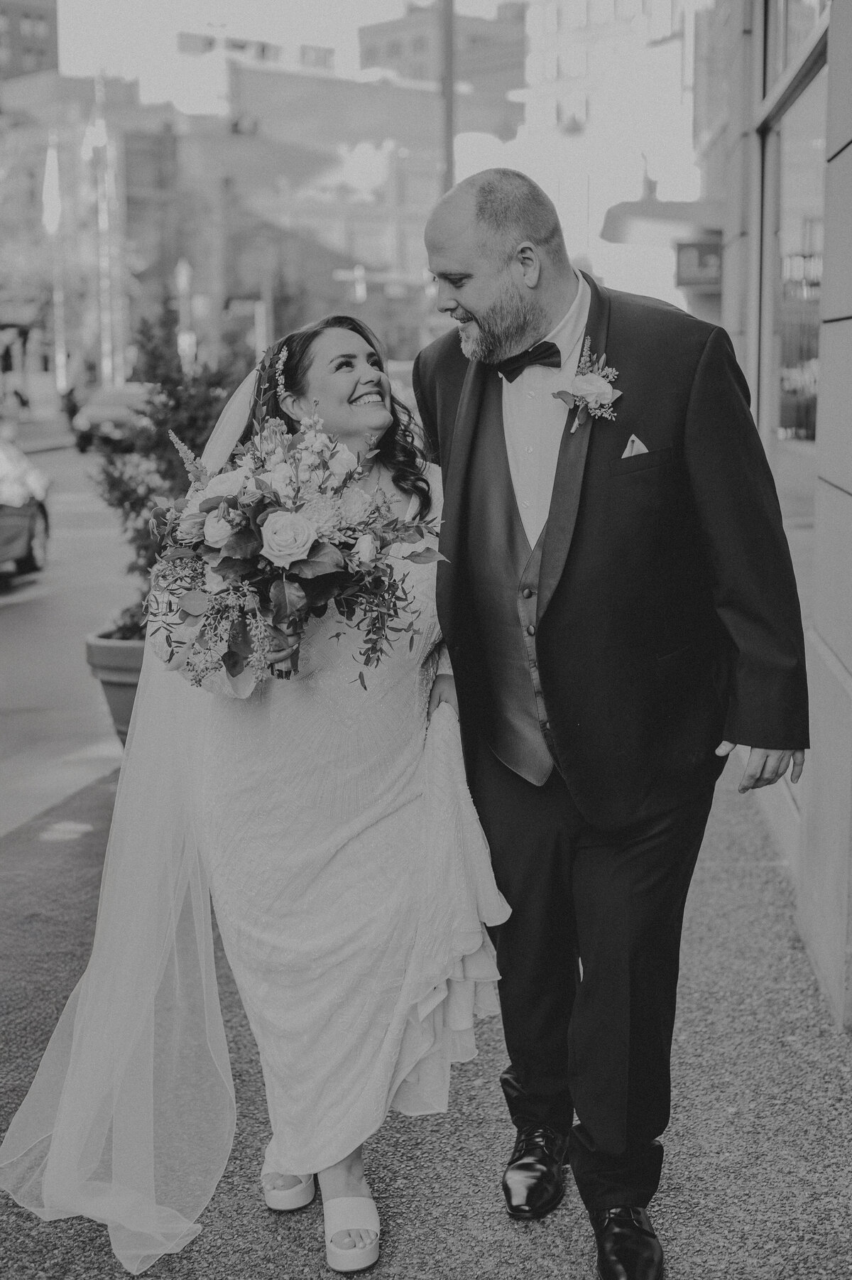 Bride and groom walking hand-in-hand down a romantic path, creating memories that will last forever | Pittsburgh Wedding Photography