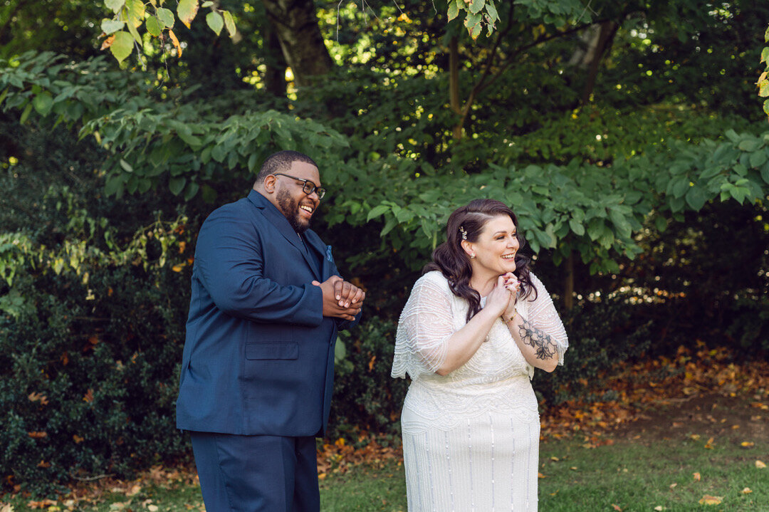 bride and groom laugh together