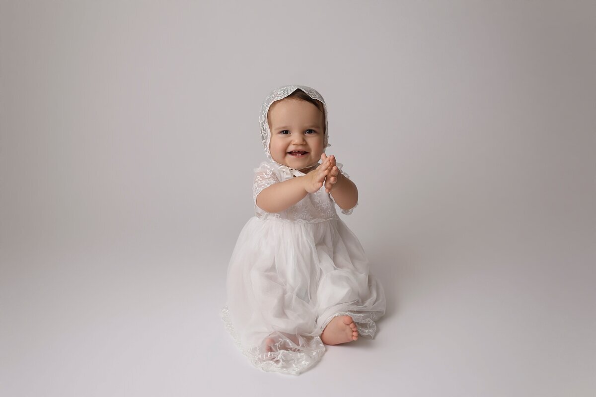 1 year old girl in gown