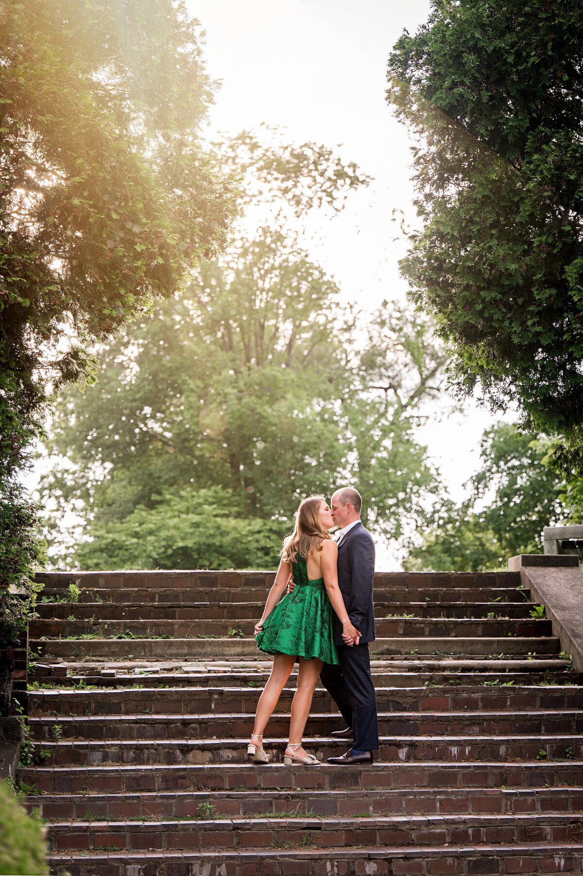 mellon park shadyside engagement photo on staircase with bride in green dress