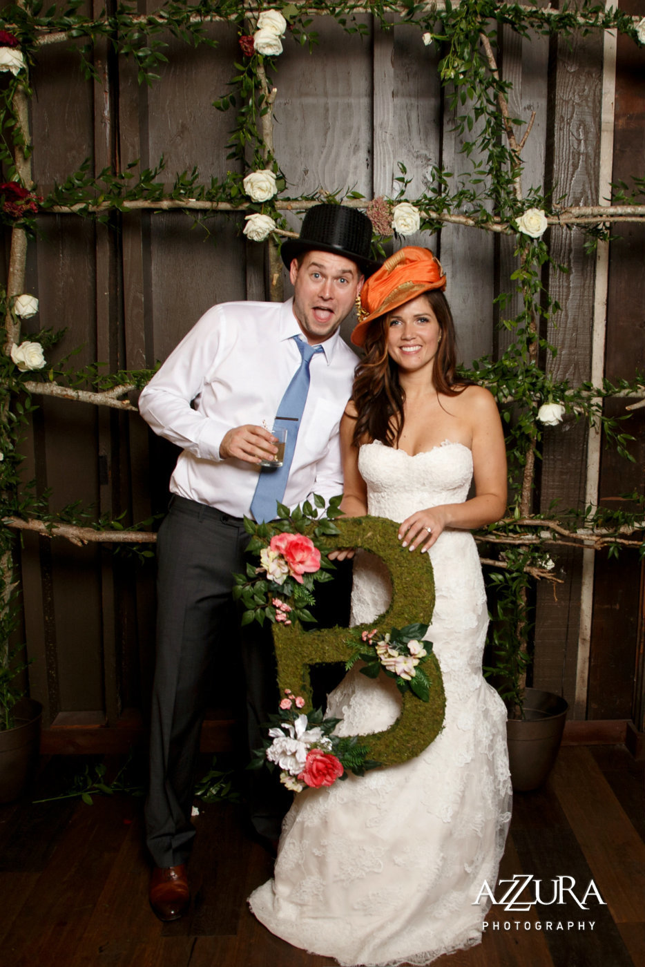 bride and groom with large moss B