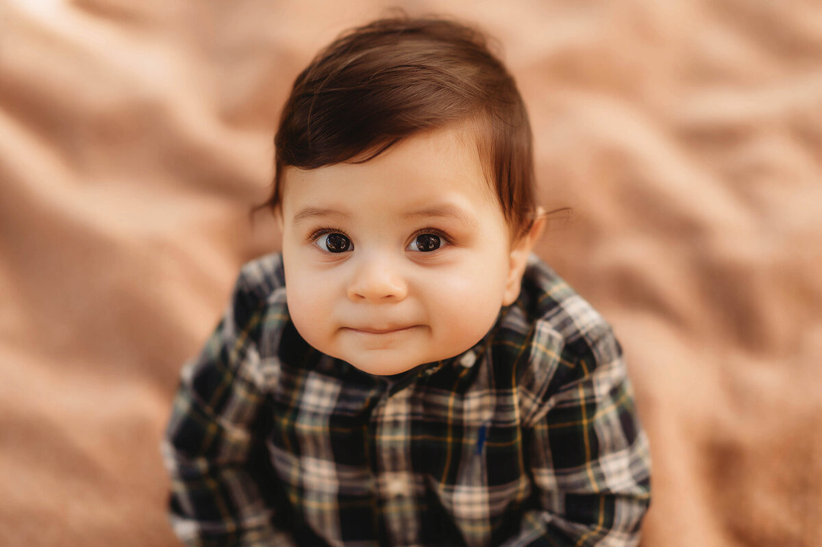 Baby peers into the camera during Family Photoshoot in Charleston, South Carolina.