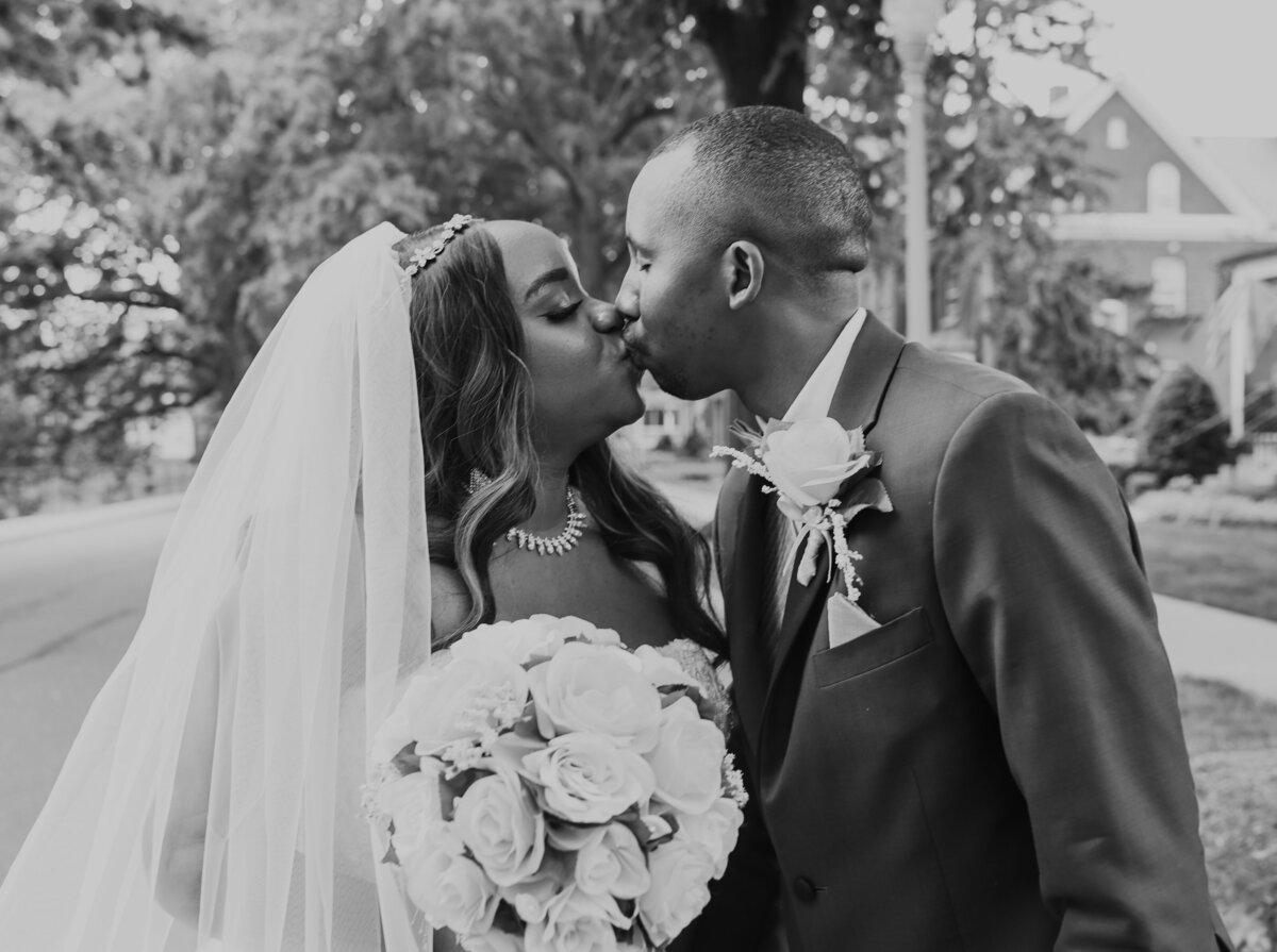 bride and groom kissing after wedding ceremony by Orlando Florida wedding photographer Amanda Richardson Photography