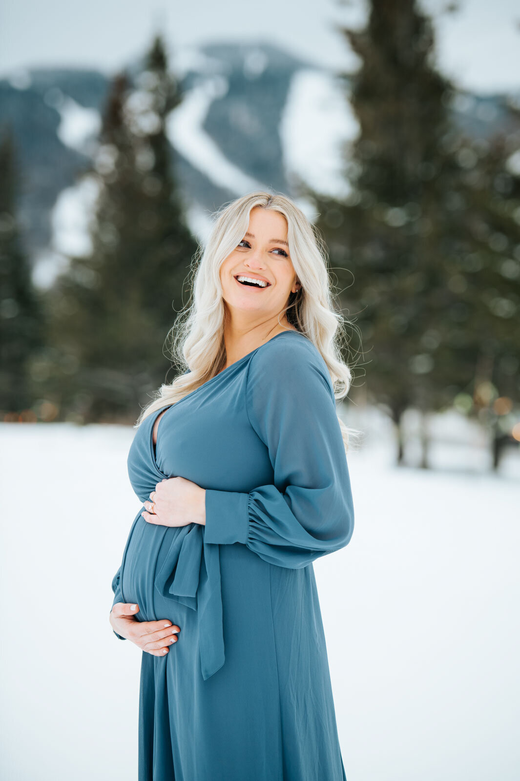 maternity portrait blue dress snow killington mountain