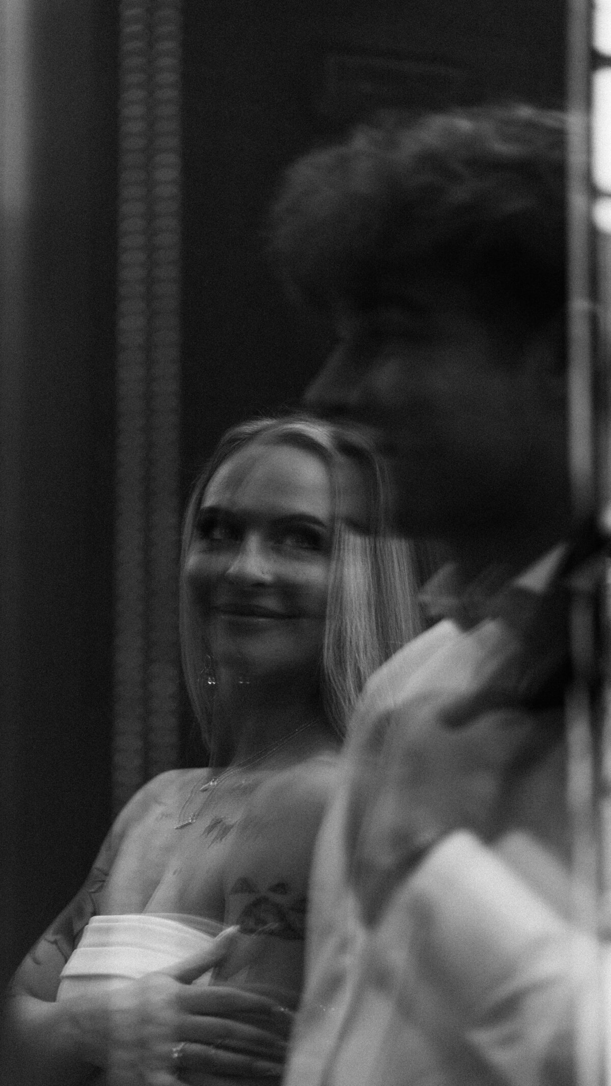 Candid moment between bride and groom — wedding photography & videography by The Proper Collective in Des Moines.