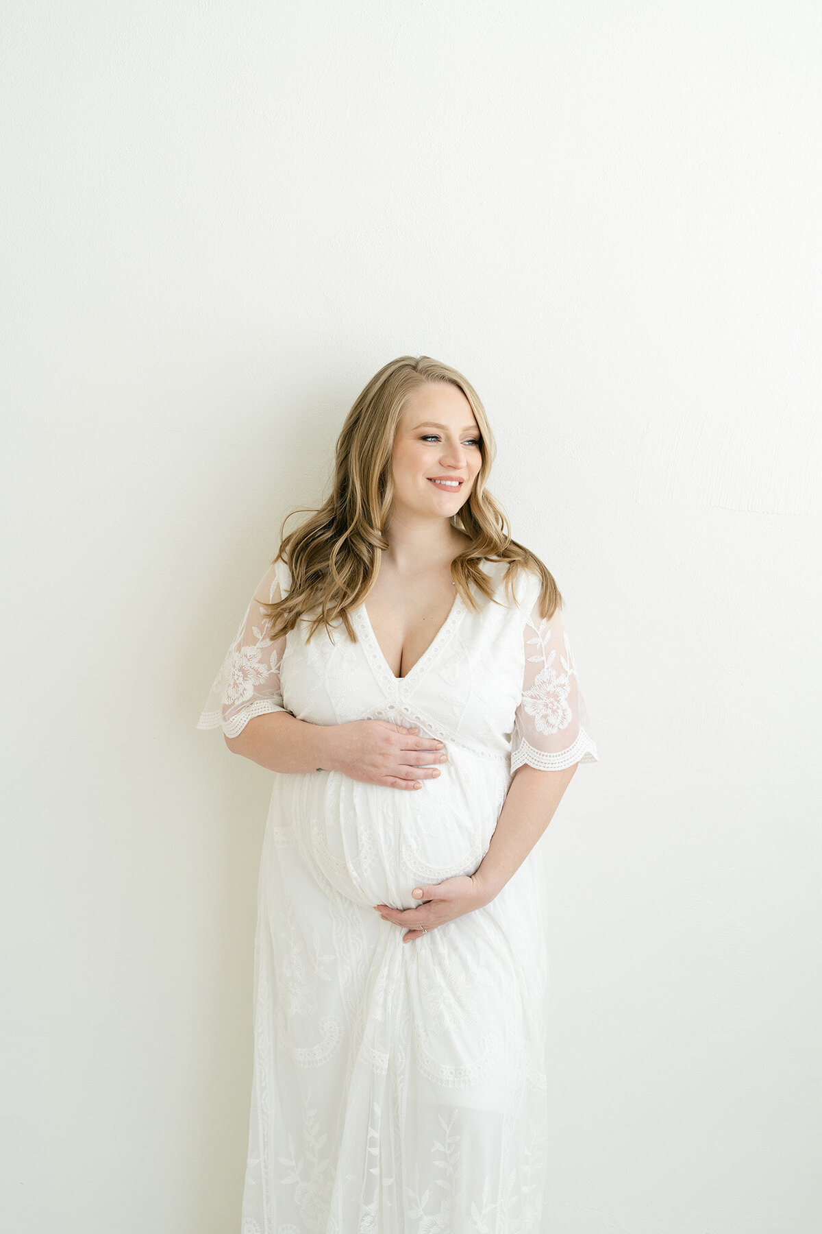 Perfect white dress for maternity photo shoot is available at Julie Brock Photography in Louisville KY