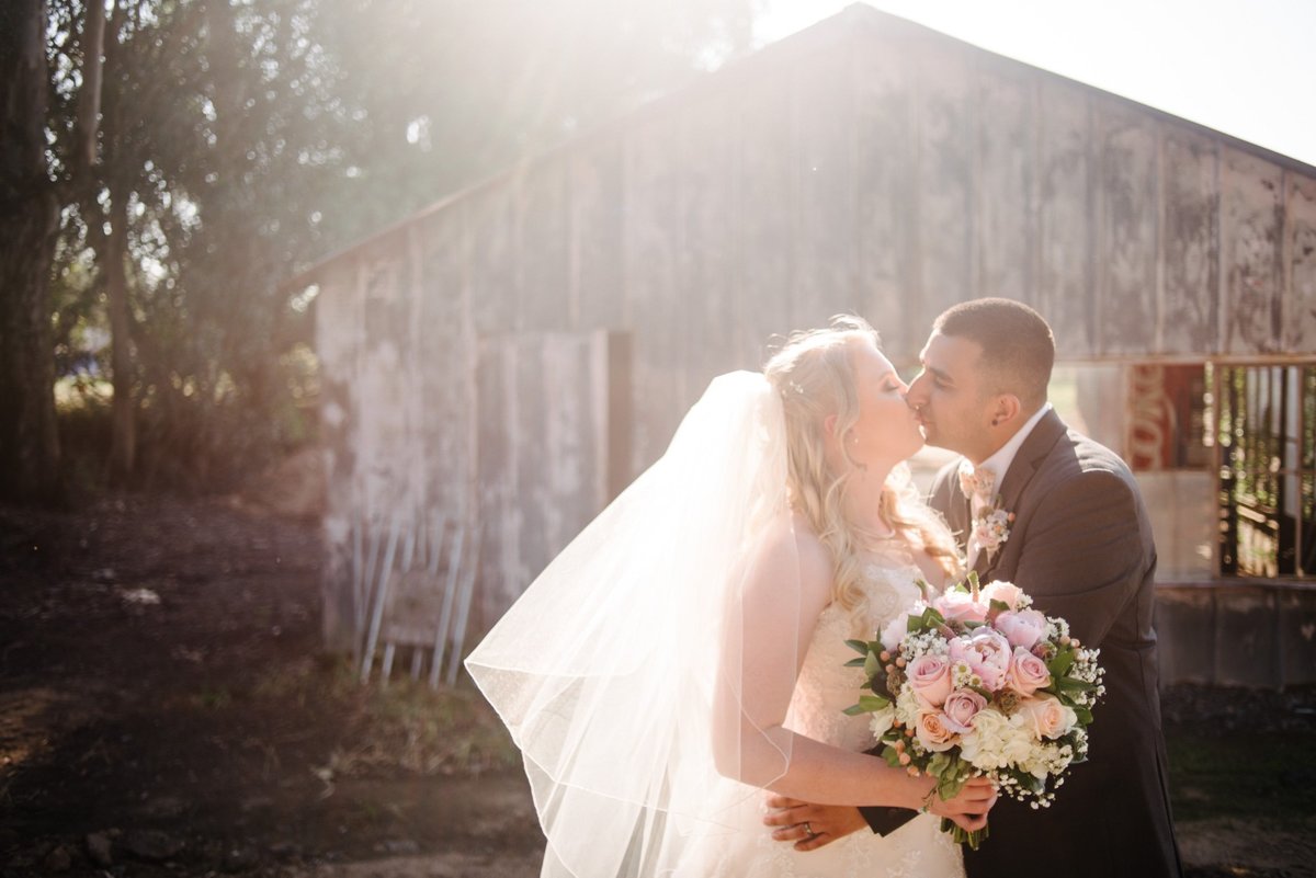 Wedding photos by a barn