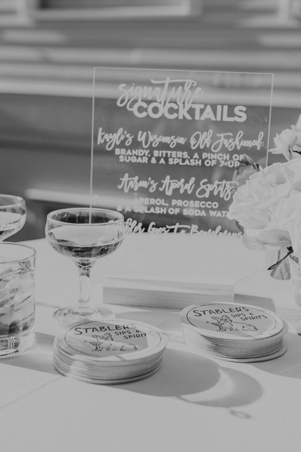 Black and white photo of drinks sign