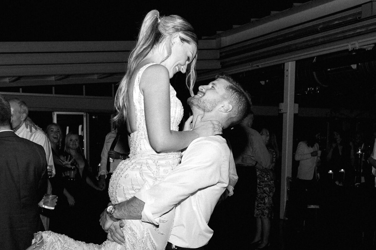 bride and groom dancing at Revery groom picking up bride