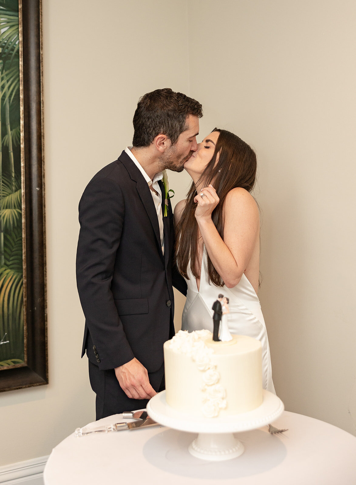 A joyful cake-cutting moment at Minette and Evan’s intimate wedding reception. Destination wedding photography by Claudia Amalia.
