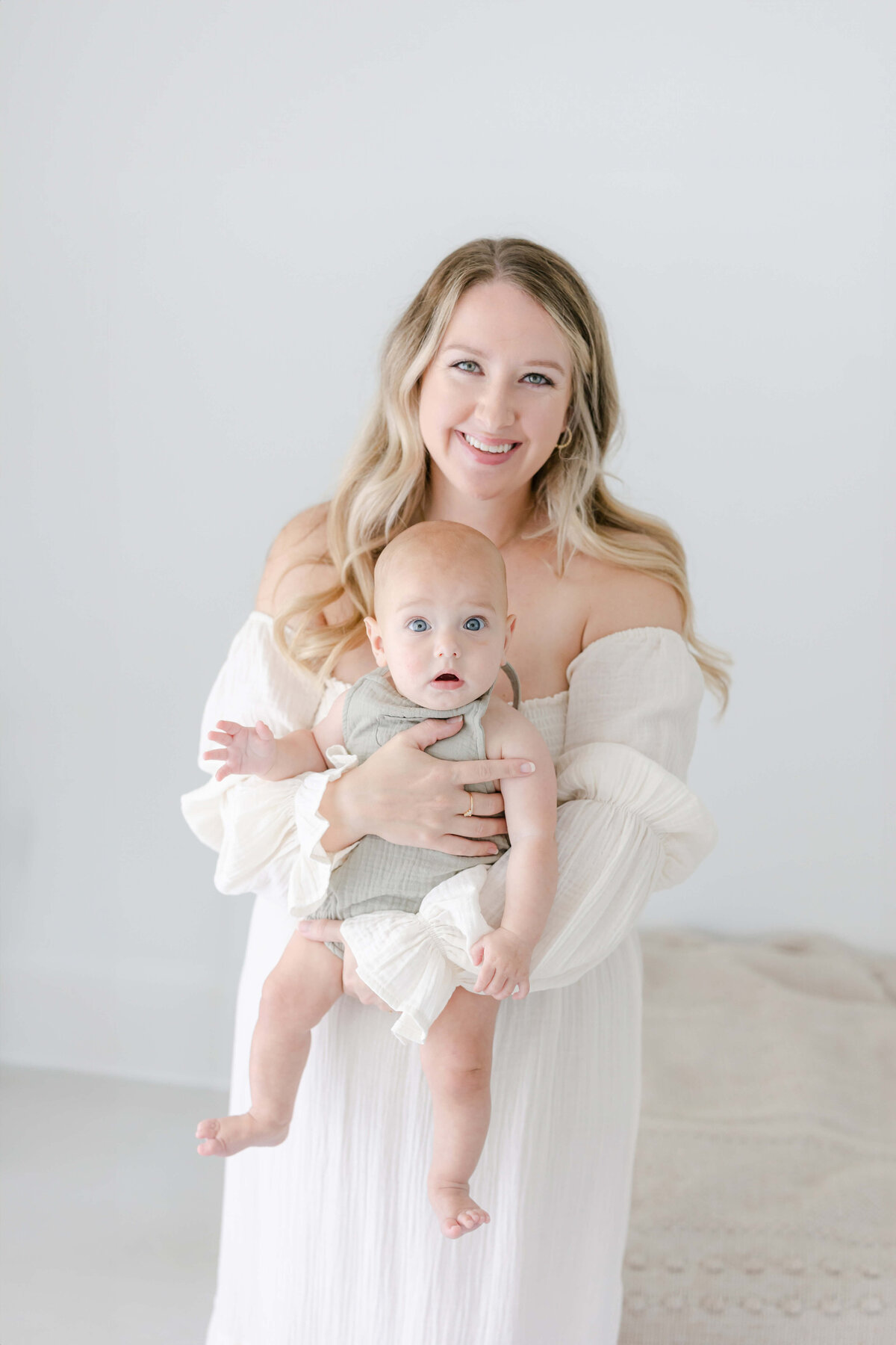 a mom holding her baby