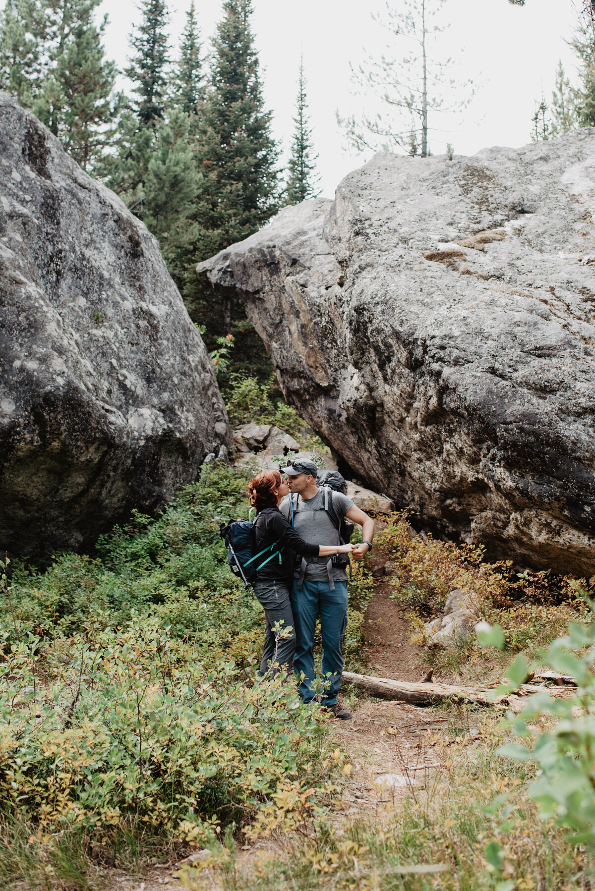 Jackson Hole Photographers capture couple kissing during hike in Grand Teton National Park