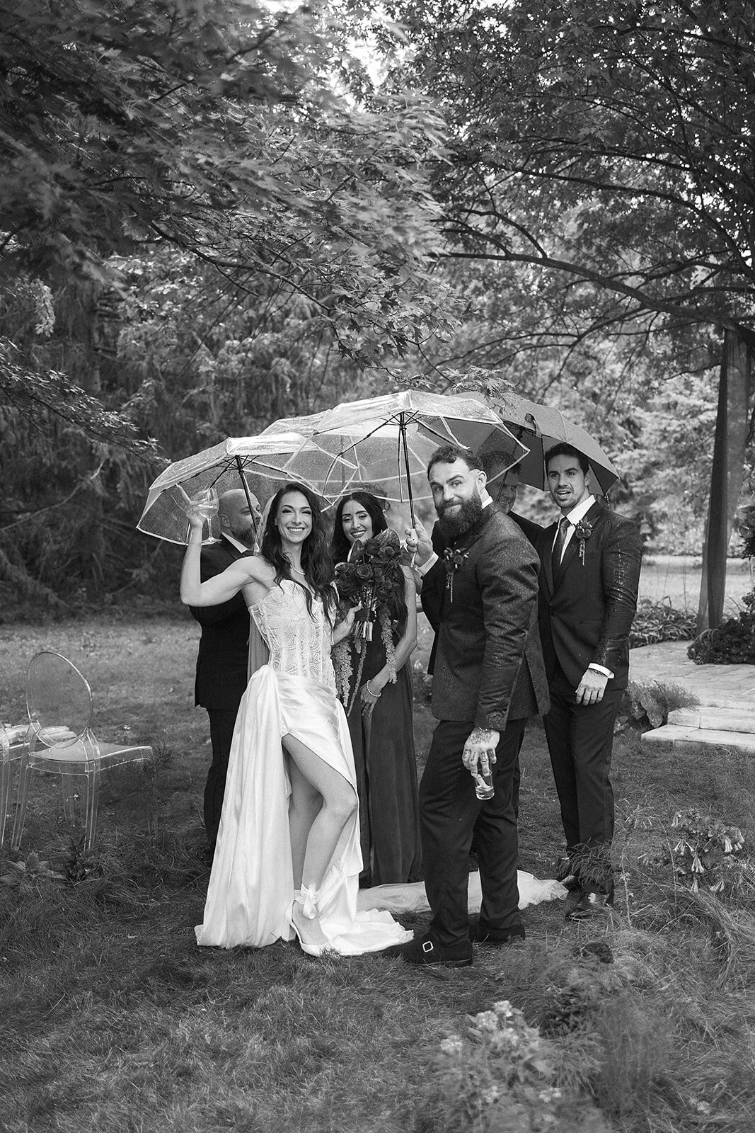 bride-groom-under-umbrellas-michigan-wedding