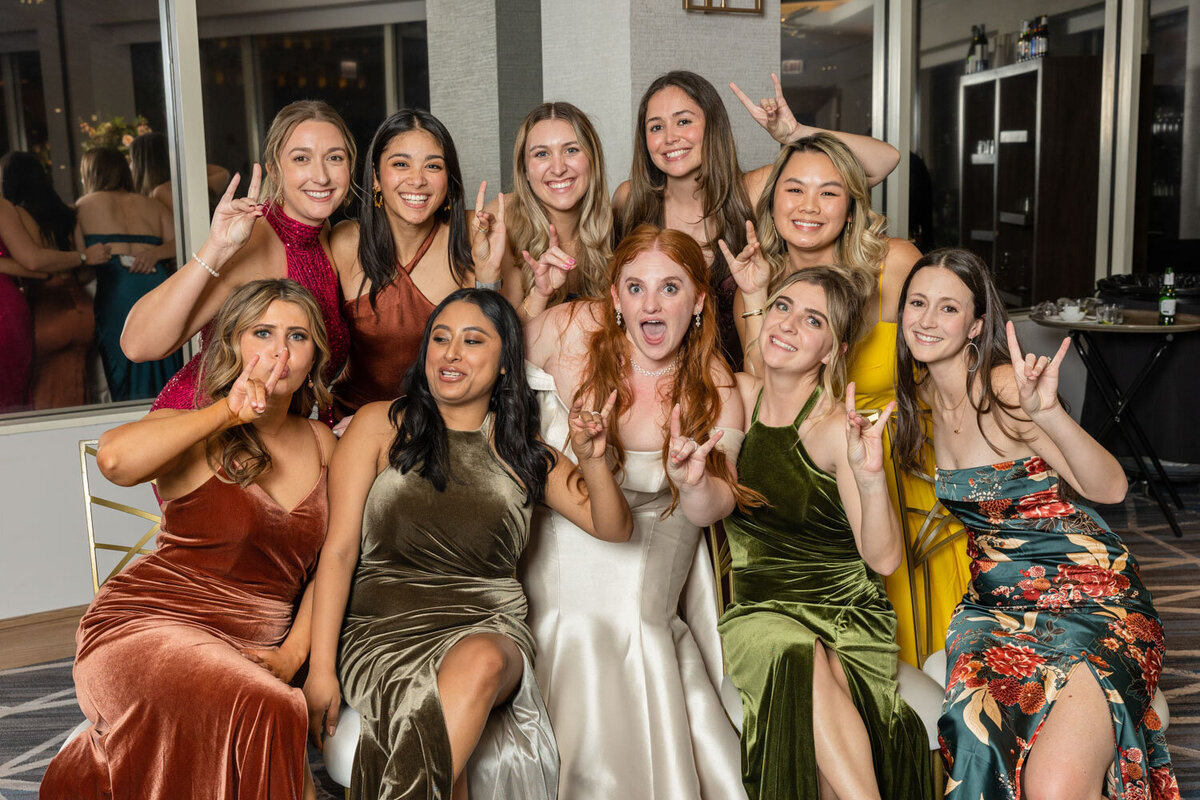 A group of women are posing for a picture together
