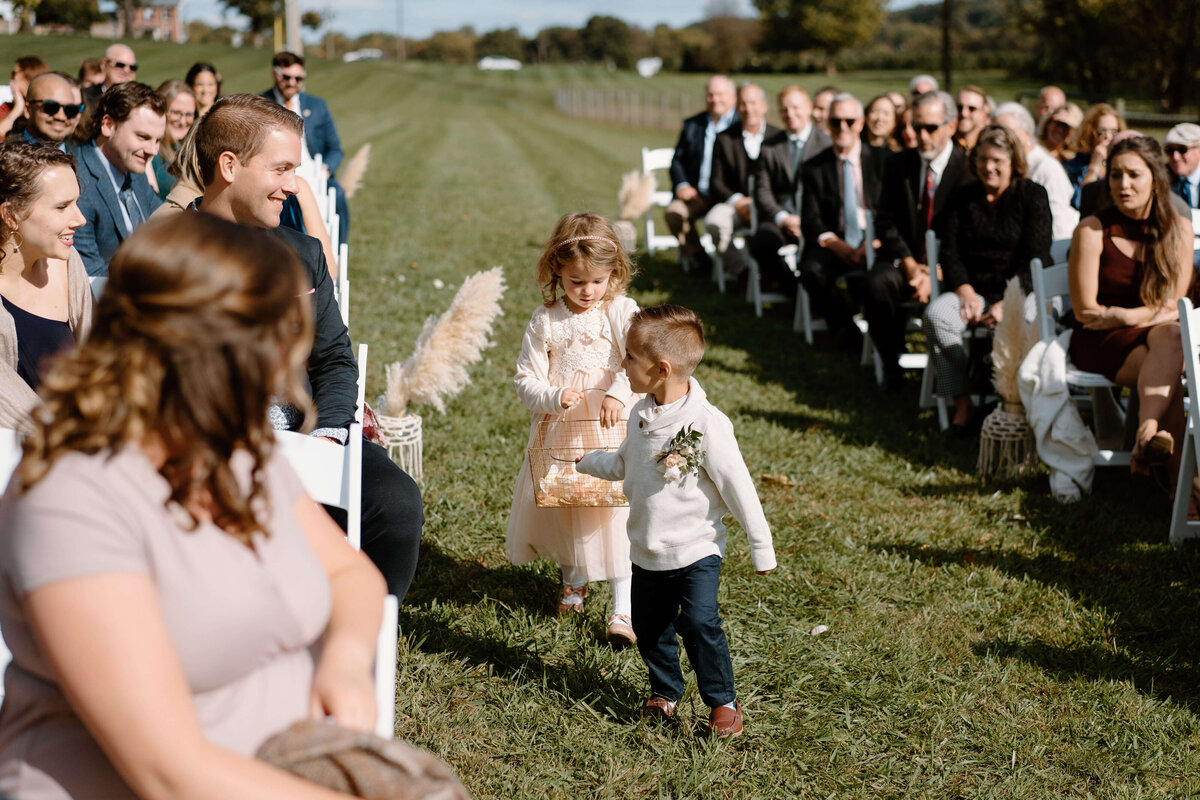 flower girl and paige boy walking down the aisle at  The Barns,  Elizabeth Farms, Lancaster PA