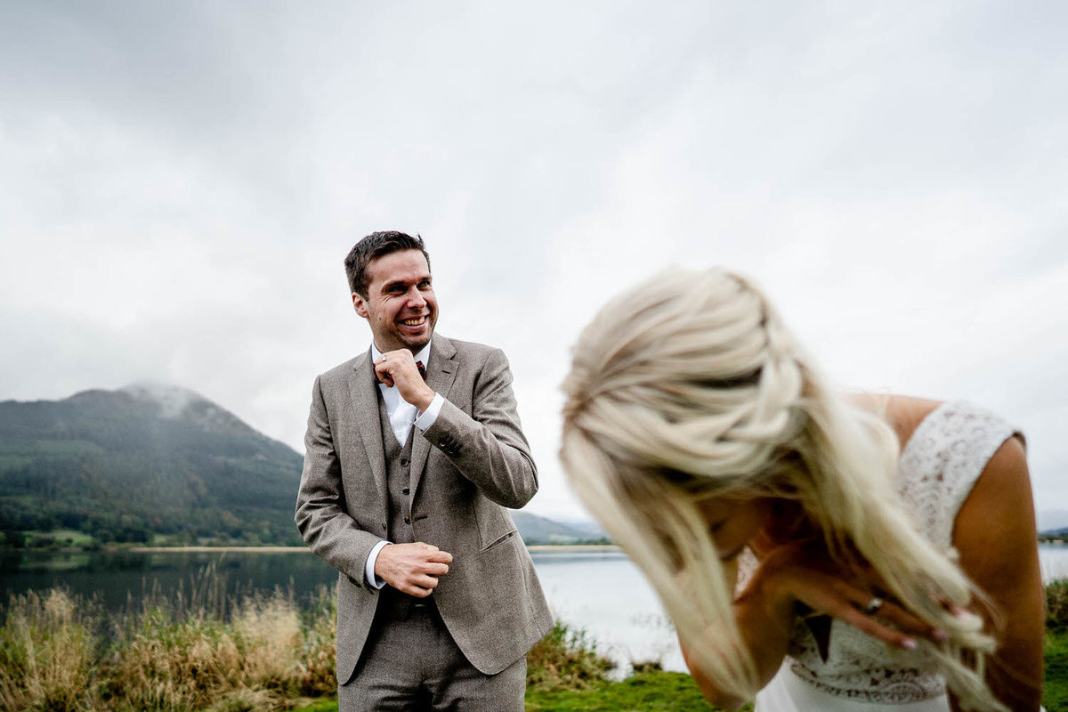 elopement wedding couples laughing by bassenthwaite in the lake district