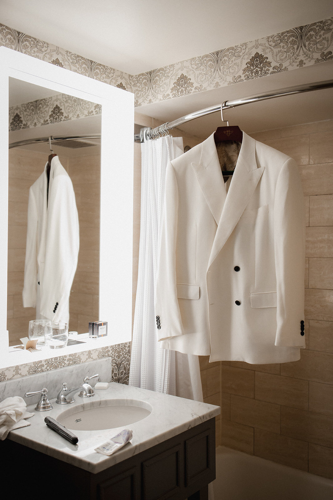 men's white suit jacket hanging