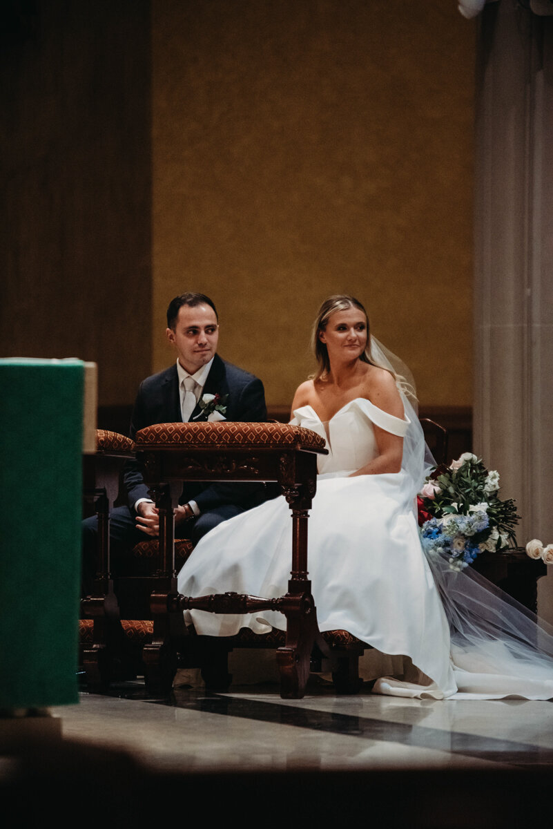 Wedding couple sits at St. John Cathedral Church