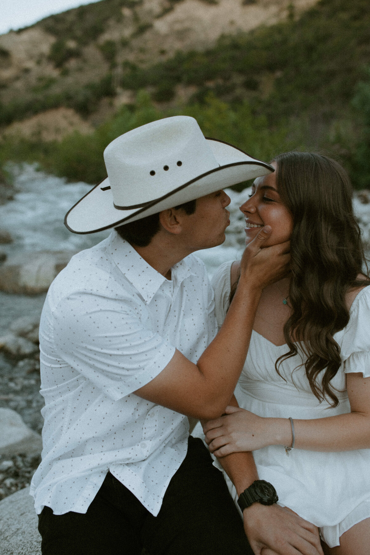 couple about to kiss sitting close together