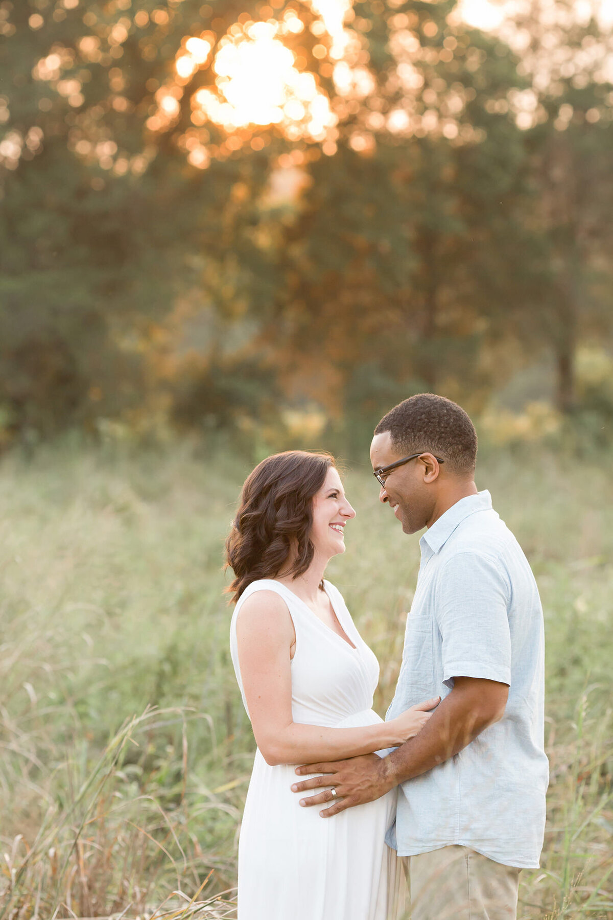 Couple posing outdoors in Louisville KY for maternity photos