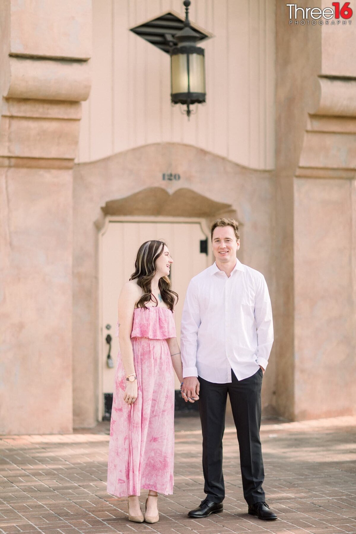 Bride to be stares at her fiance during photo session at the Fullerton Train Station