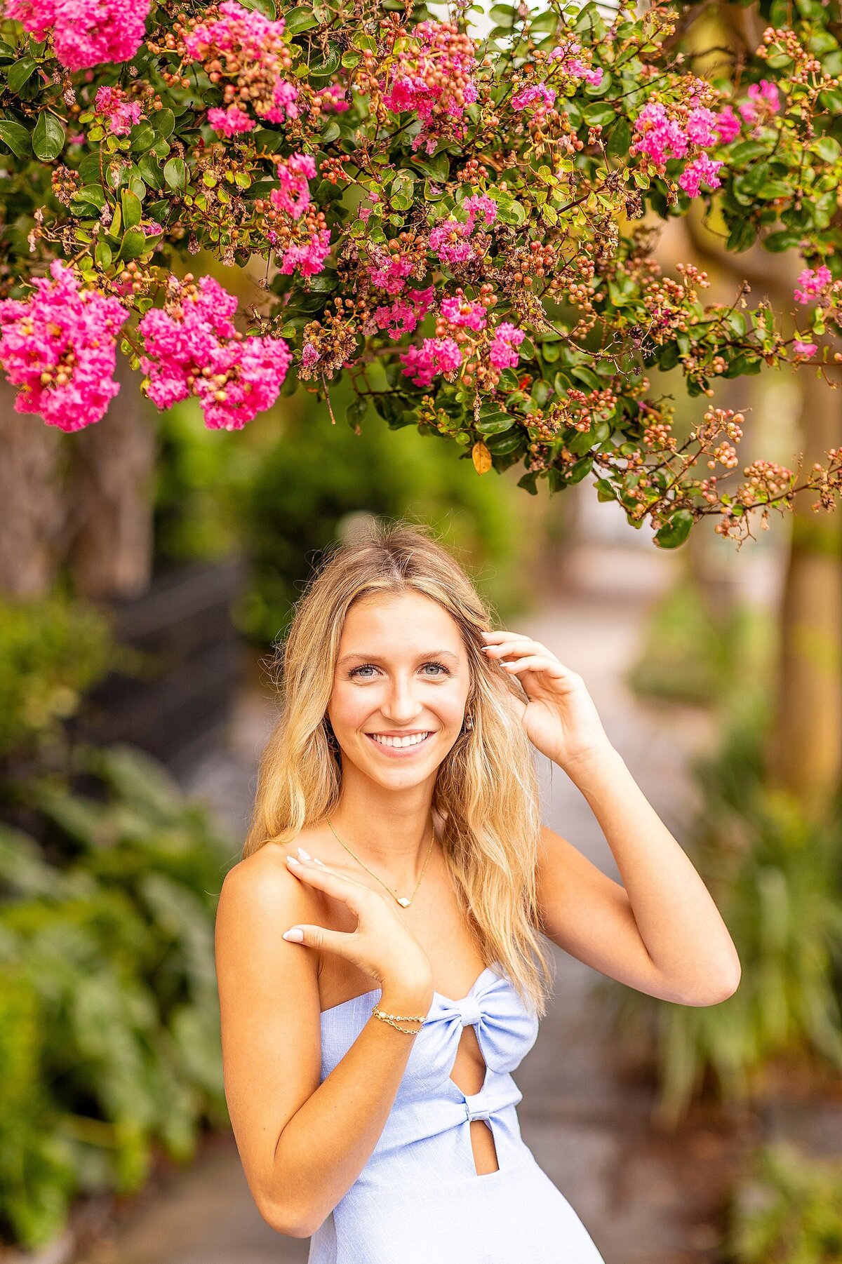 Senior portrait at Rainbow Row in Charleston, SC, showcasing joyful, light-filled moments