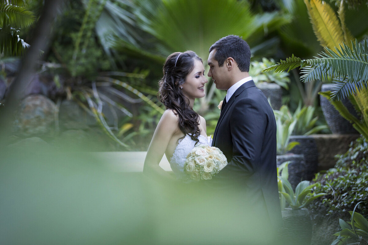 Exquisite wedding shots amidst the lush greens of Villa Botanica, Airlie Beach.