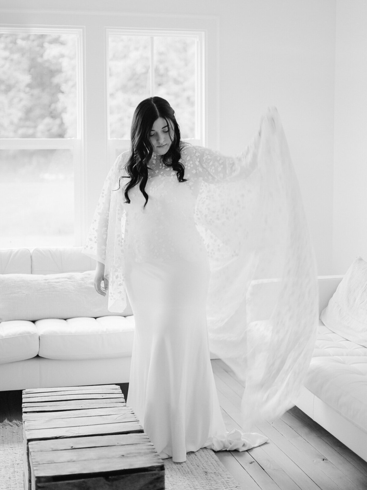 bride in bridal cape at Glass House Community, Michigan wedding venue