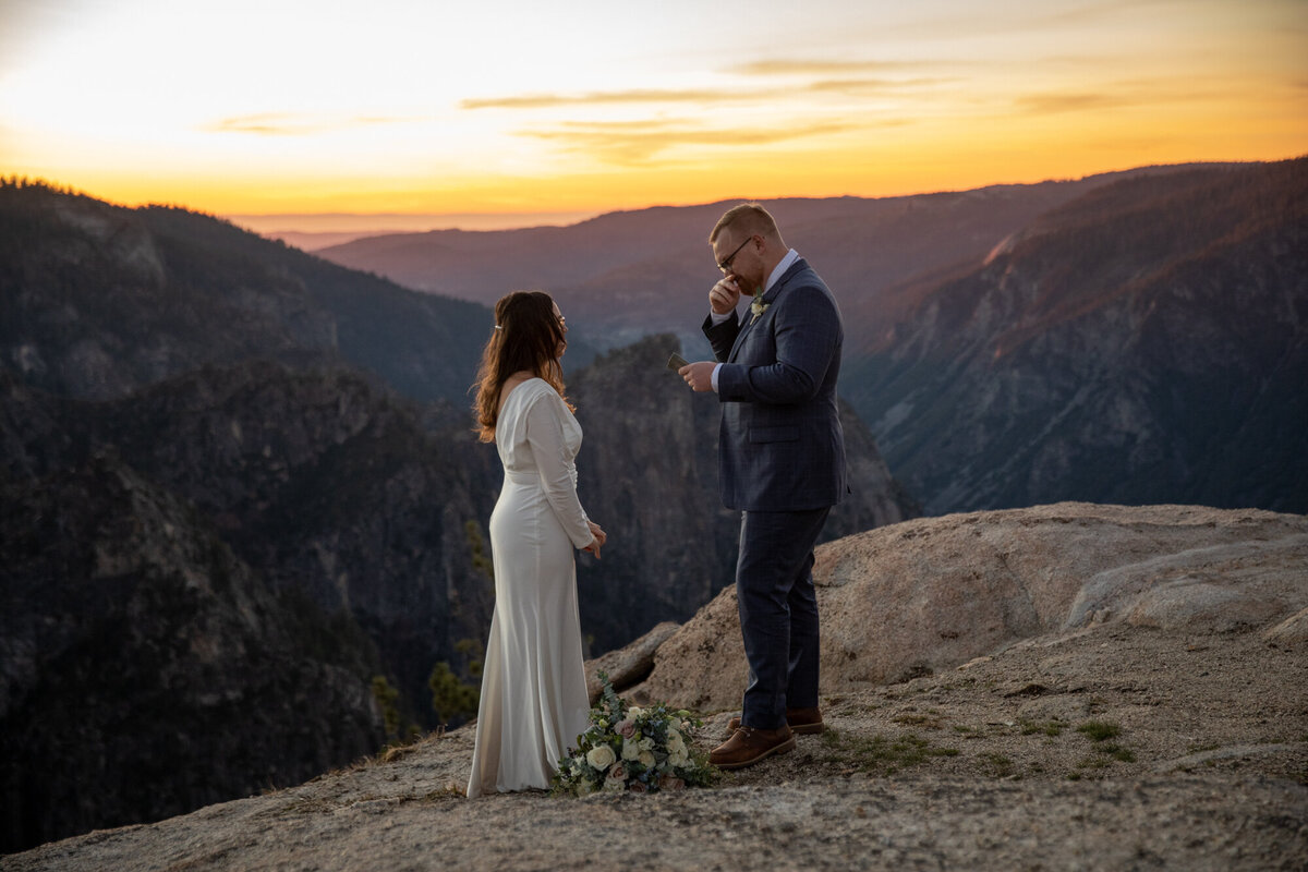 A groom reads his vows to his bride during their California elopement ceremony.