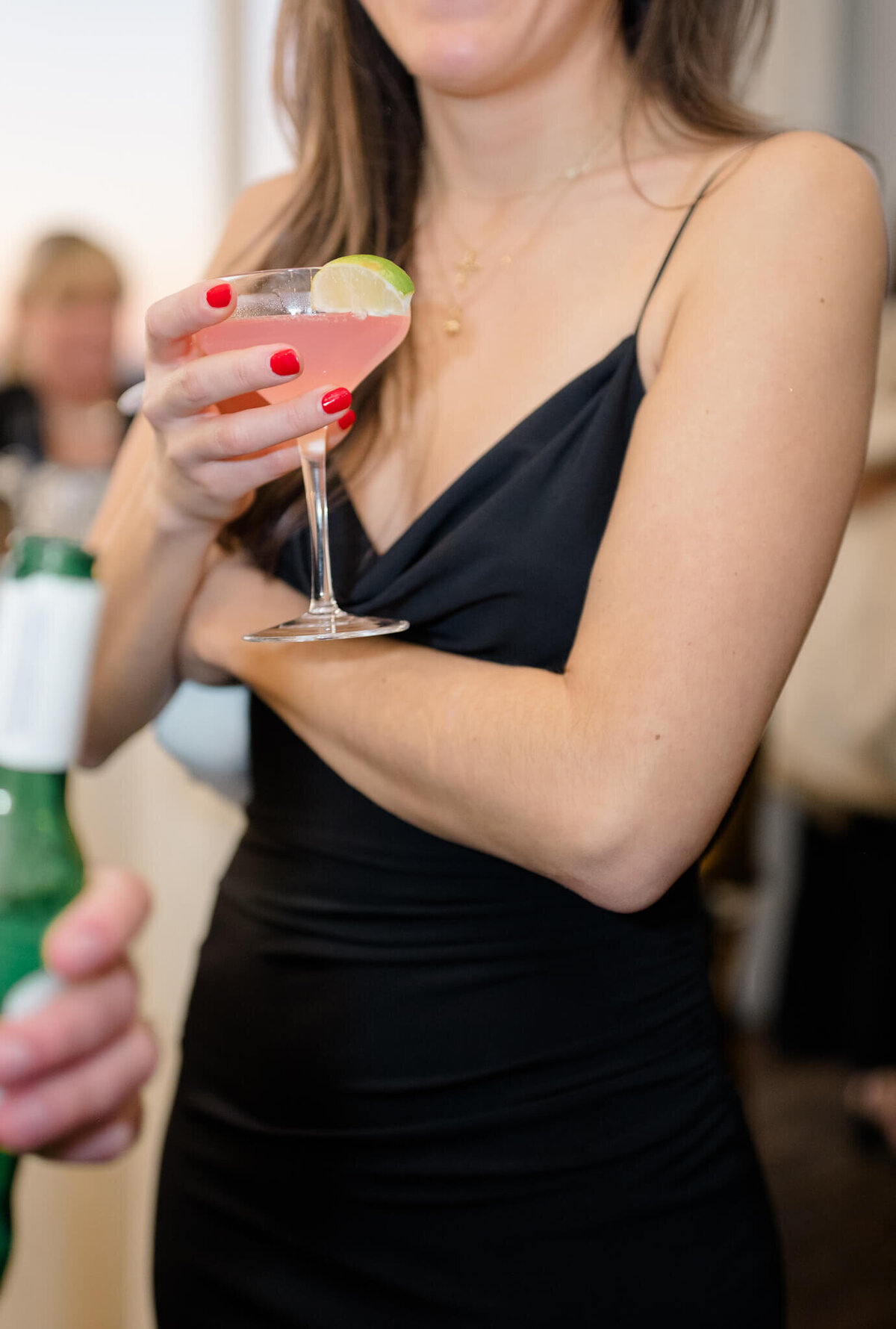 Guest holding a cocktail during cocktail hour at Chesapeake Bay Beach Club on Kent Island.