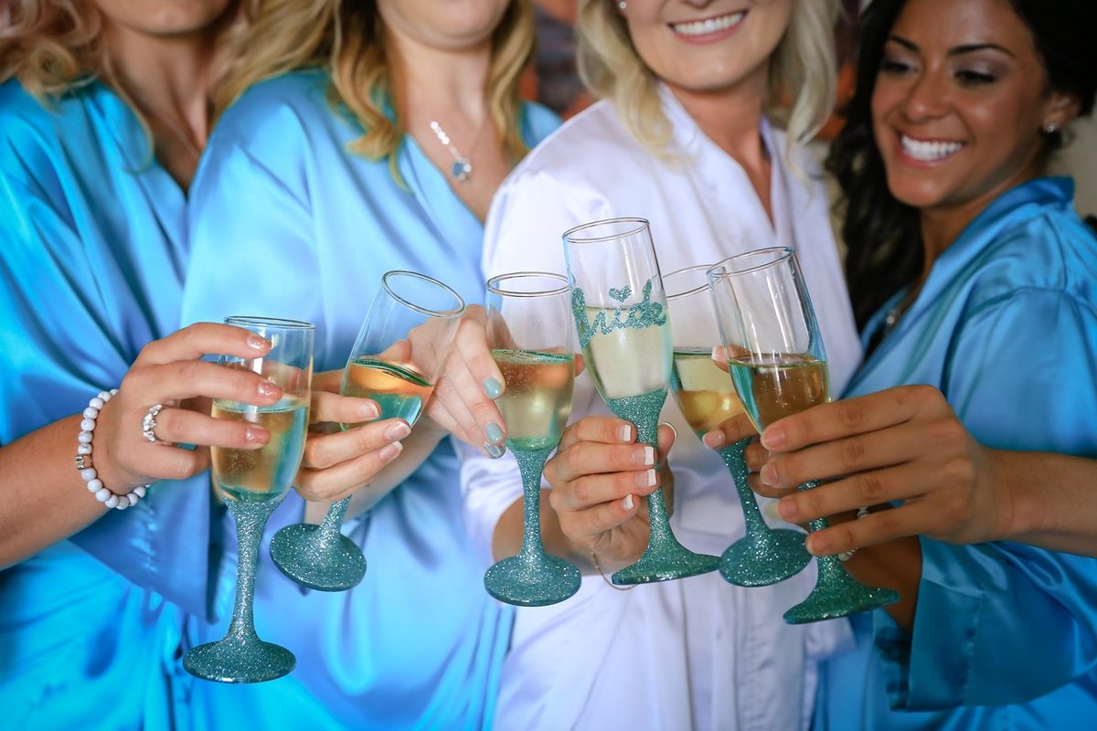 Maui Wedding Photography at The Westin Maui Resort and Spa of the  bride and bridesmaids toasting