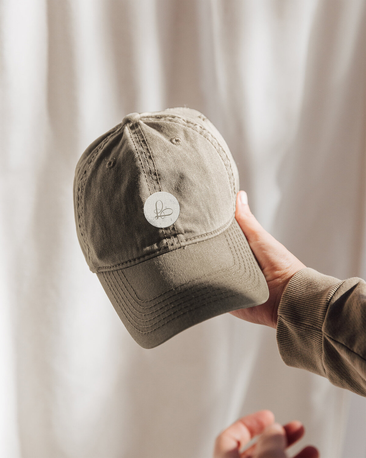 Loué Merchandising Cap | Logo Design op Textiel