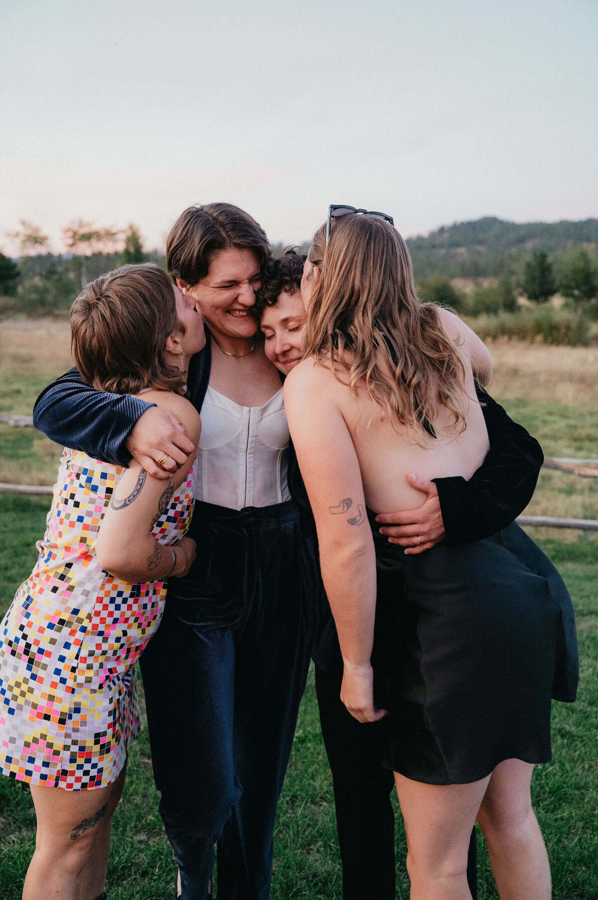 Wedding couple and guests embracing