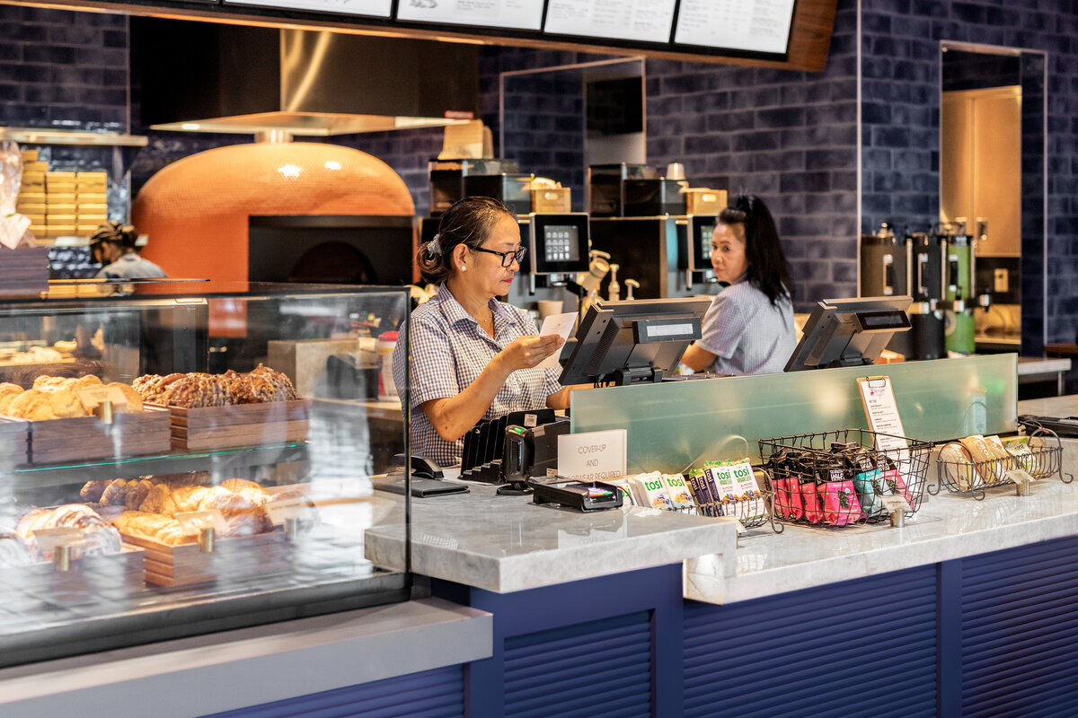 Two Loulu employees at the Grand Wailea Resort and Hotel's Loulu gourmet grab and go cafe.
